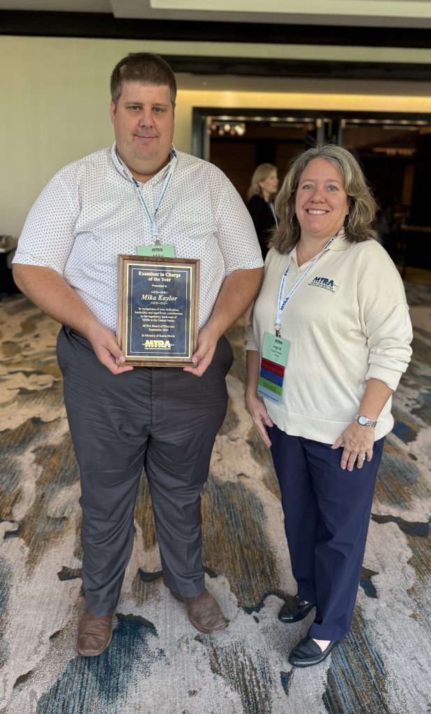Mika Kaylor accepting the award from MTRA President Ingrid White